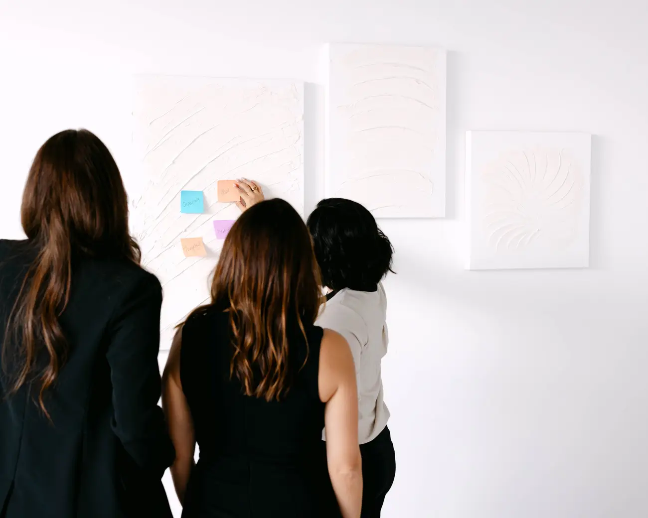 The team planning at a wall of sticky notes
